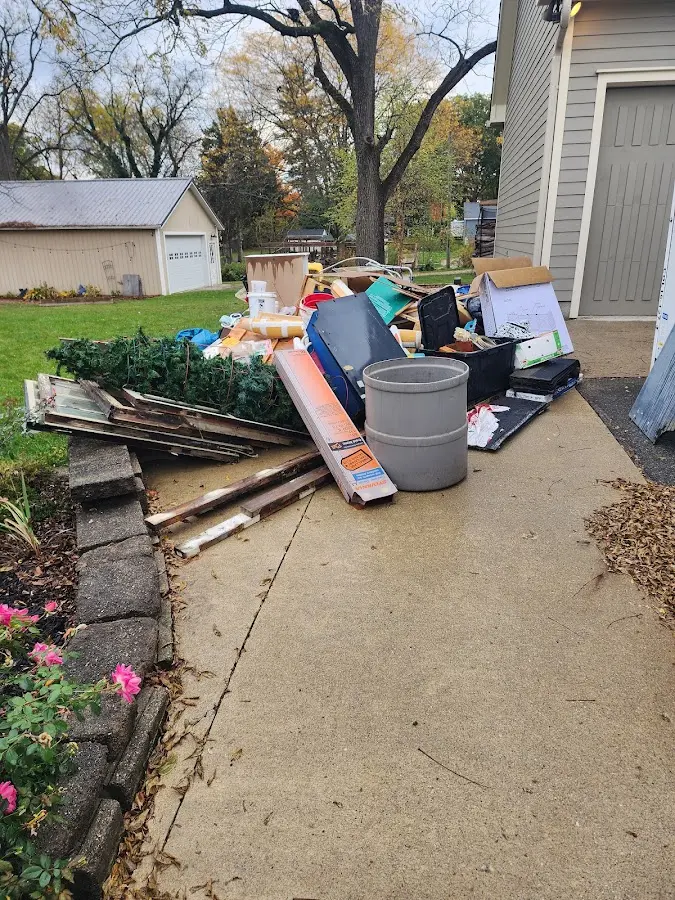 Dumpster being loaded with debris for Residential Dumpster Rental in West Laurel